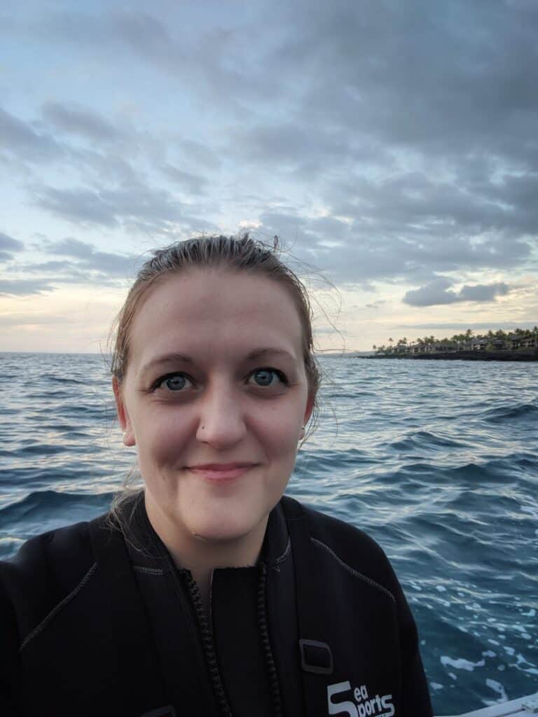 Me in my wet suit on the boat heading out to Manta Village