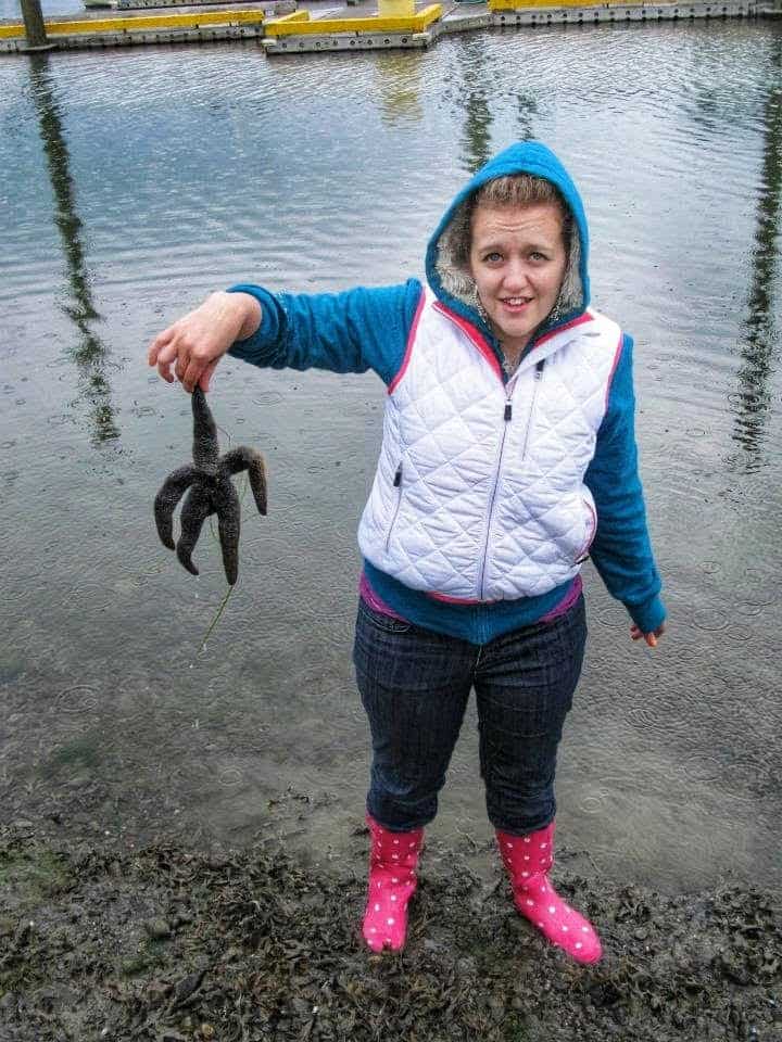 holding a starfish at lowtide