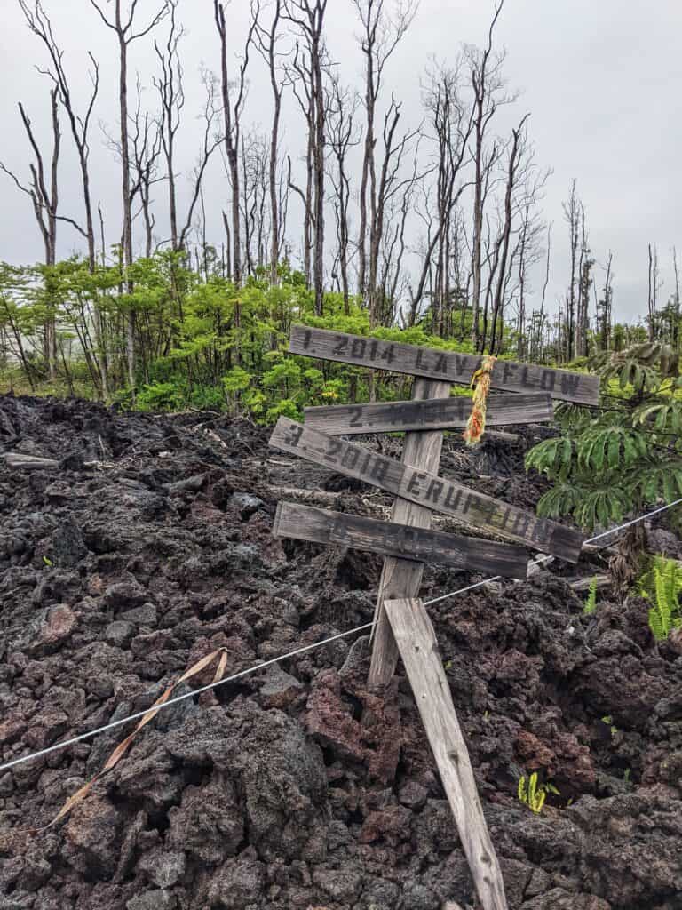fun signage about lava years posted in lava from the 2018 kilauea volcano eruption in leilani estates, the second stop on this hawaii lava tour