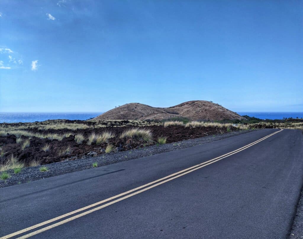 pu'u ku'ili looms in the distance on the drive to kua bay beach