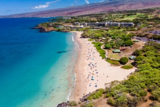 ariel view of hapuna beach with white sand and blue water