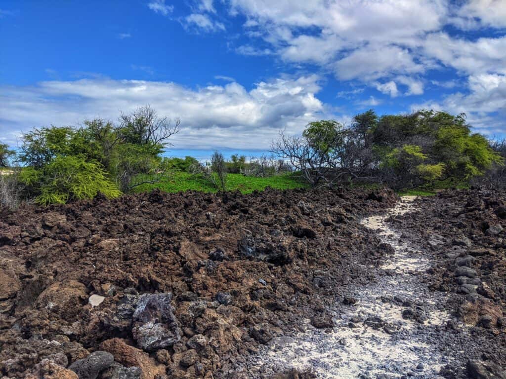 lava path to sand path on the route to makalawena beach