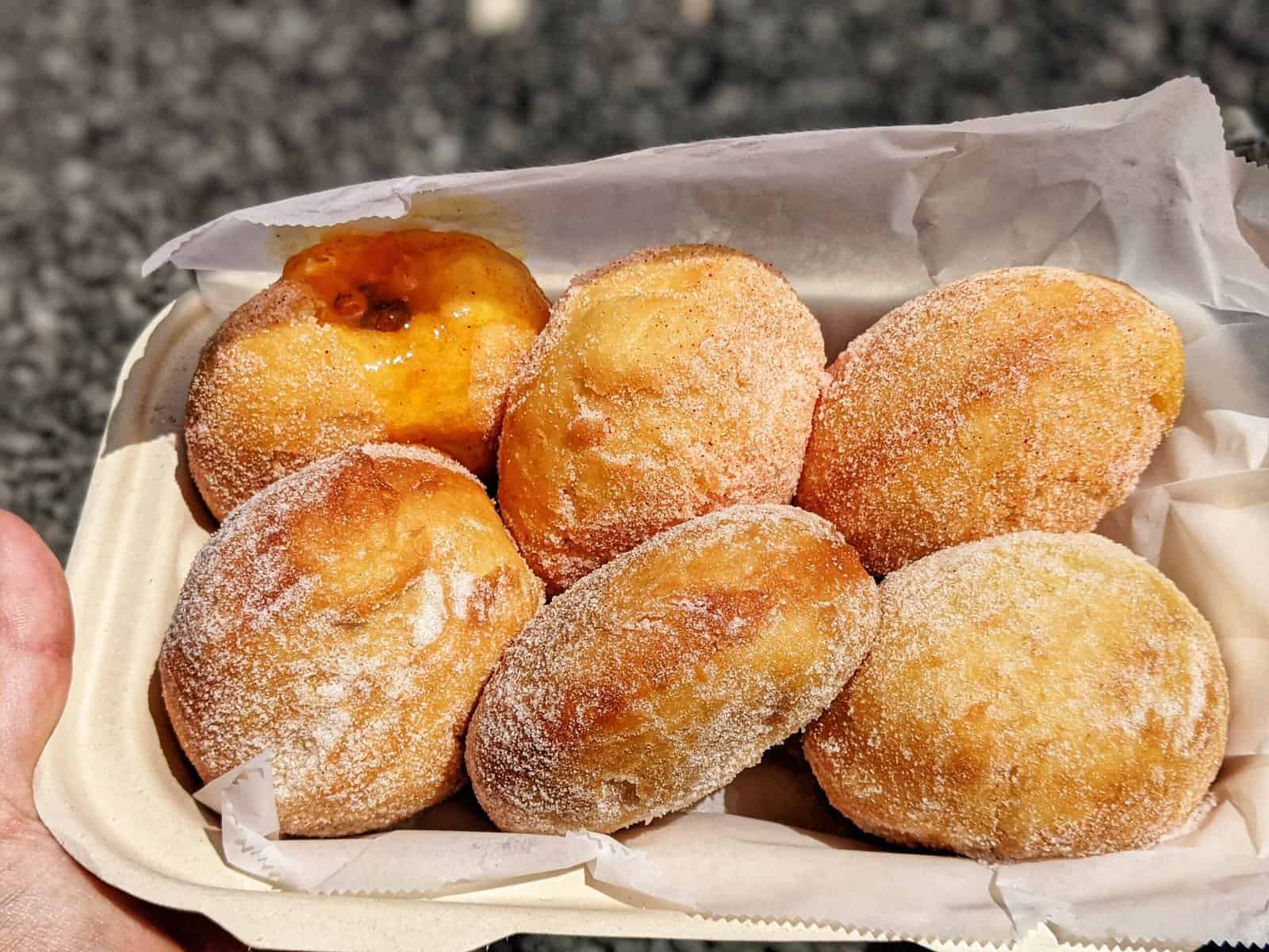 half a dozen malasadas from the blue food truck