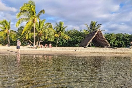 alu beach with a grass roofed shaded a frame
