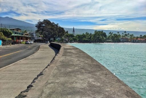 alii drive road and sea wall with church steeple in distance