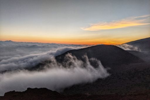 Mauna Loa at sunset with a sea of clouds below