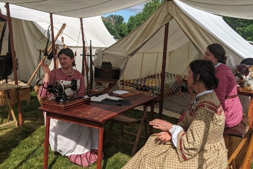 ladies sewing and hanging in period clothing at civil war reenactment yakima