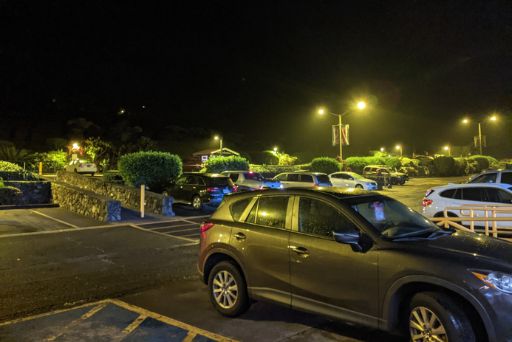 dim yellow lights at night in a parking lot