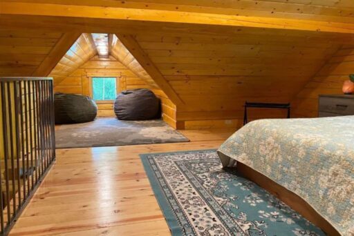 fun reading nook in the loft of the best Cabins for Rent in Wasilla