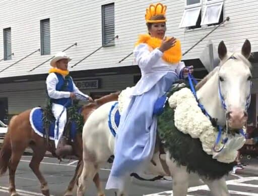 pa'u rider dressed in white and yellow in merrie monarch parade