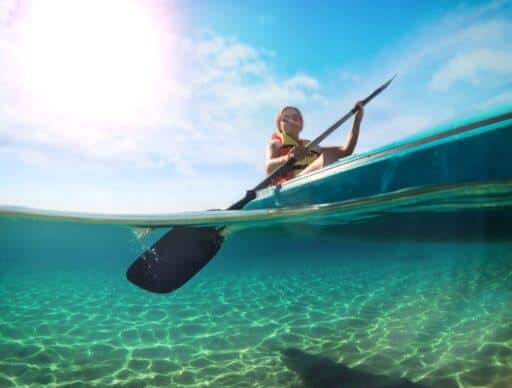 kayaking in hawaii with picture half underwater