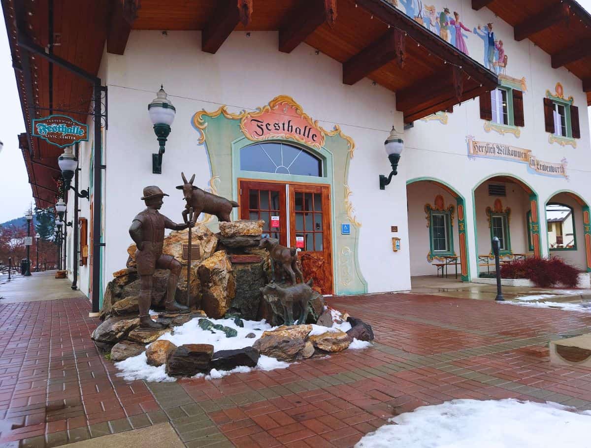 festhalle front door with bronze statue of goats and herder on the the brick sidewalk