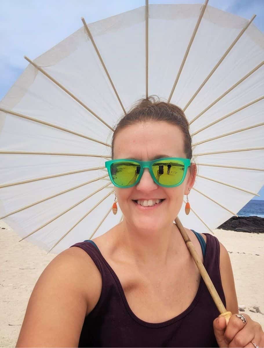 me in sunglasses and a parasol to protect me from the sun