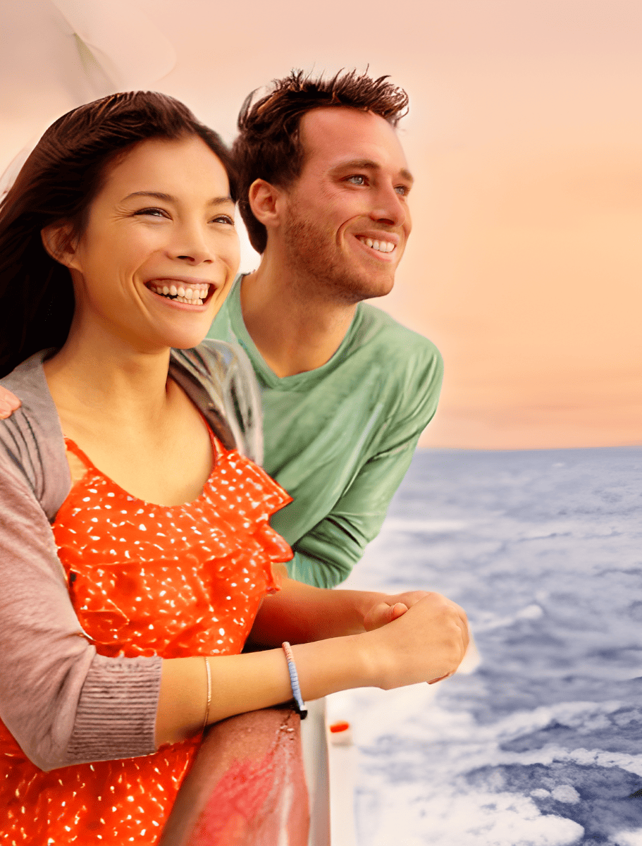 couple looking out from sunset cruise boat in hawaii