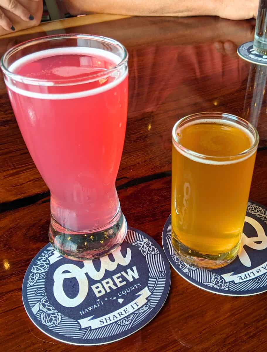 Two glasses of beer on coasters from Ola Brew, highlighting local craft beer tasting as a rainy-day activity