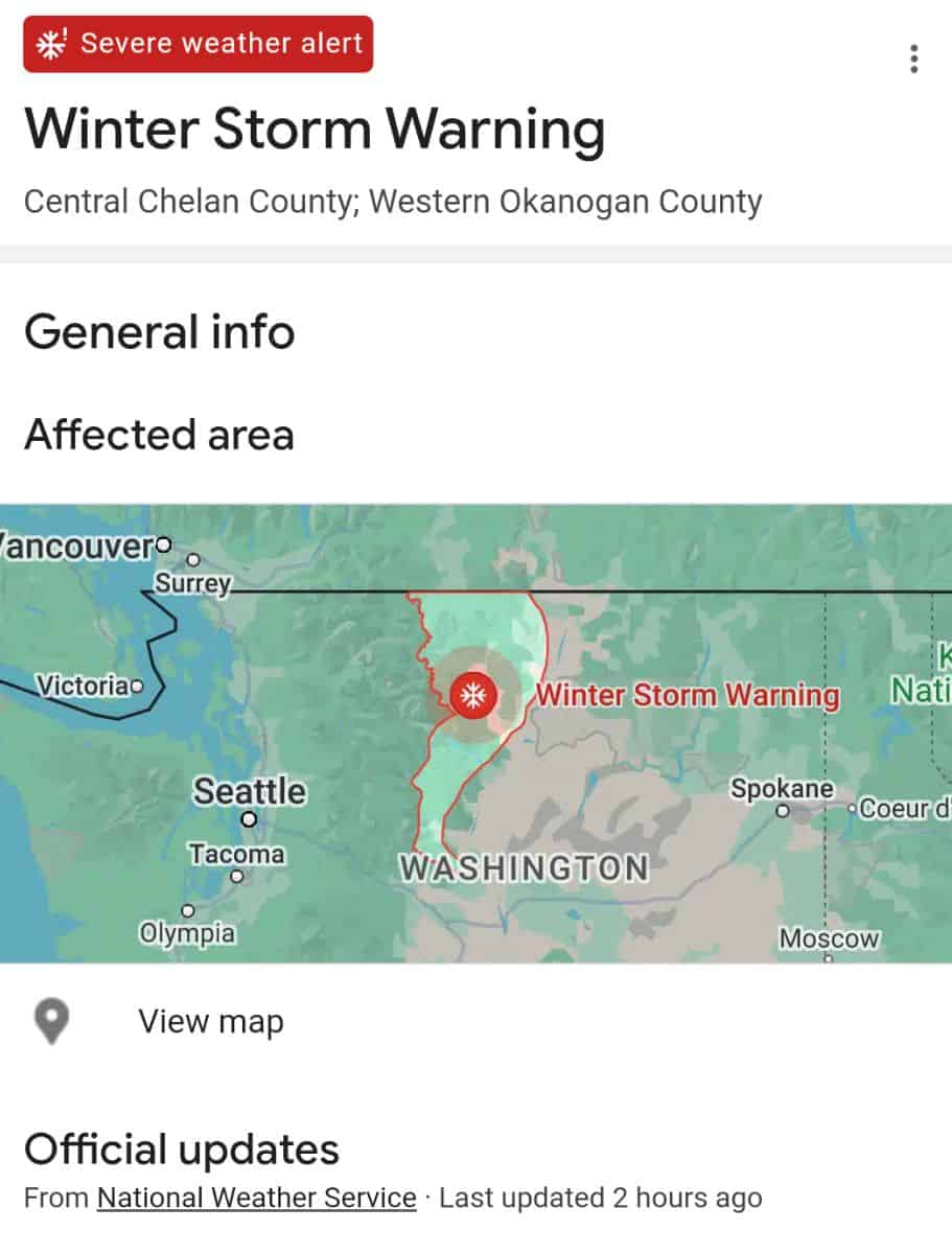 A screenshot of a winter storm warning alert for Central Chelan County and Western Okanogan County with a map showing the affected area in red.