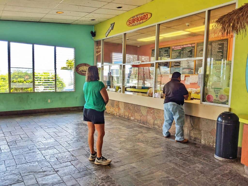 Colorful interior of Tex Drive-In with people standing in line to order