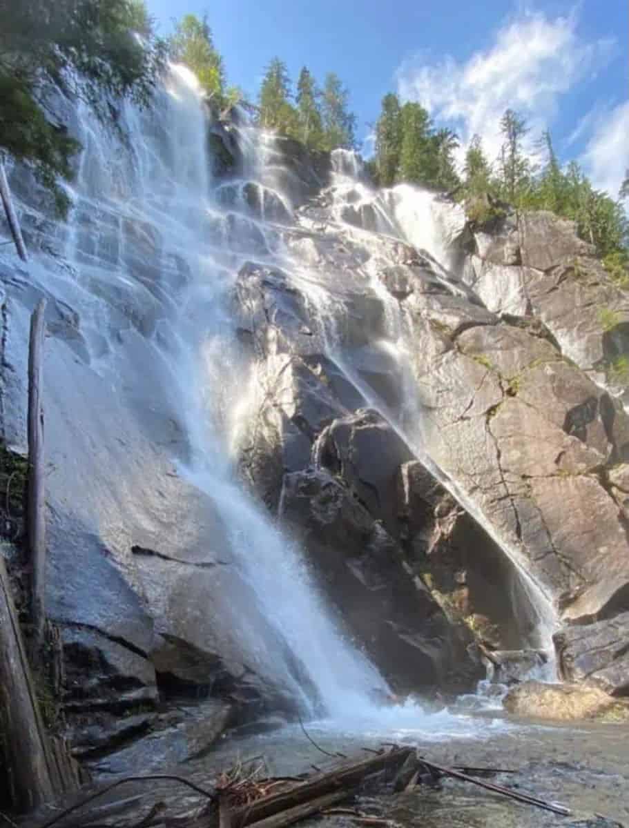 Bridal Veil Falls cascading over chunky rocky cliff with evergreens at the top