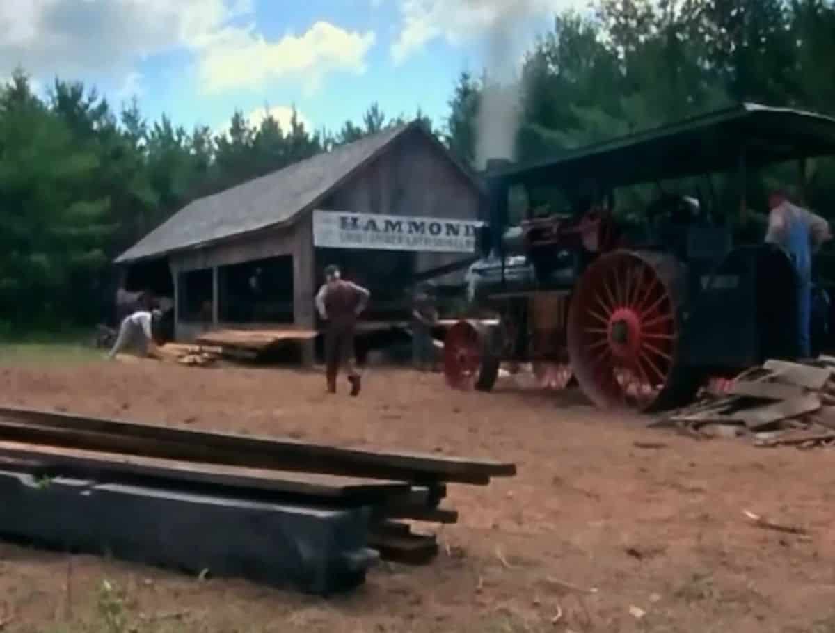 Hammond Mill scene from Anne of Green Gables with lumber in pile and lumber equipment
