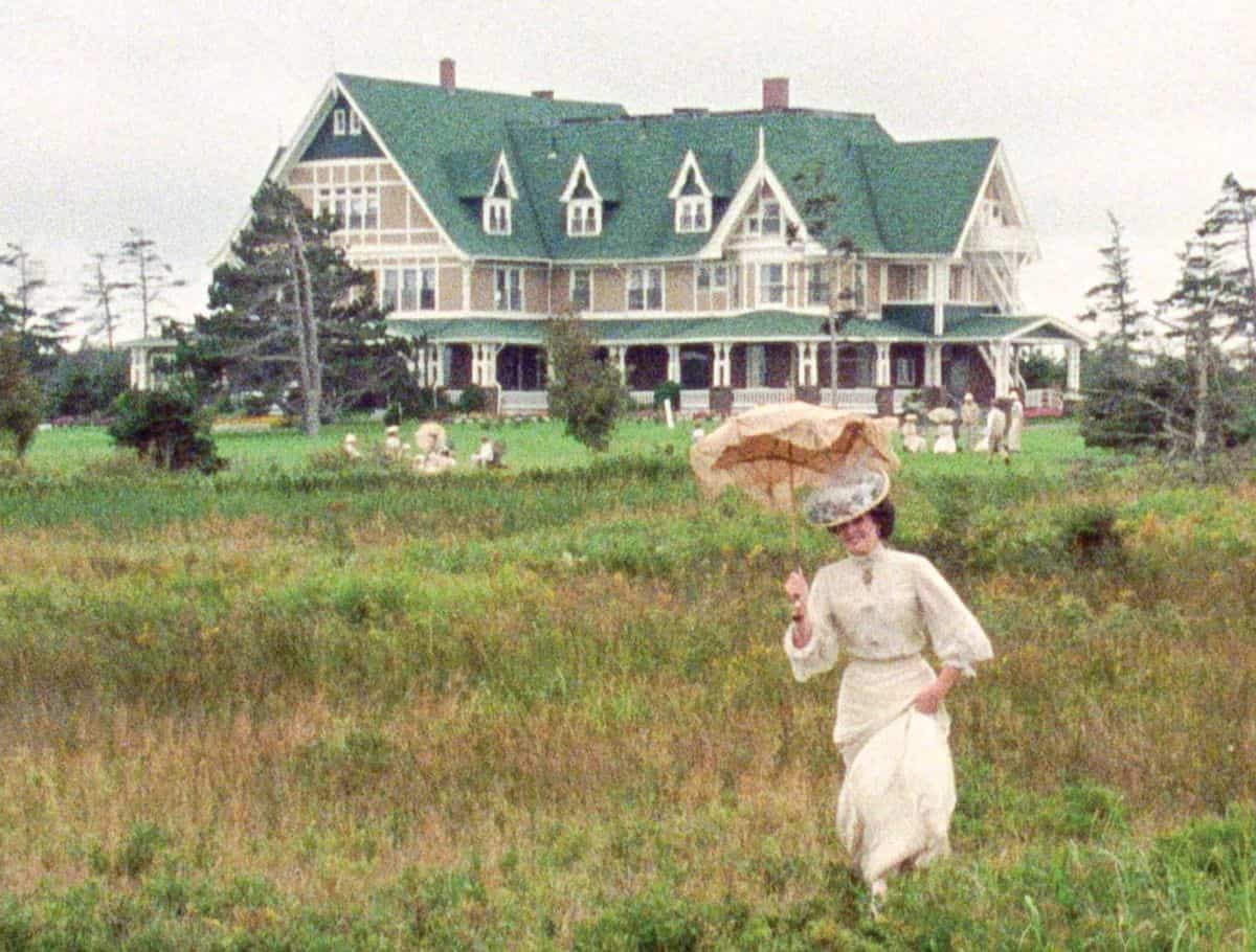 Scene of White Sands Hotel from Anne of Avonlea with morgan's fiance traipsing through the grass