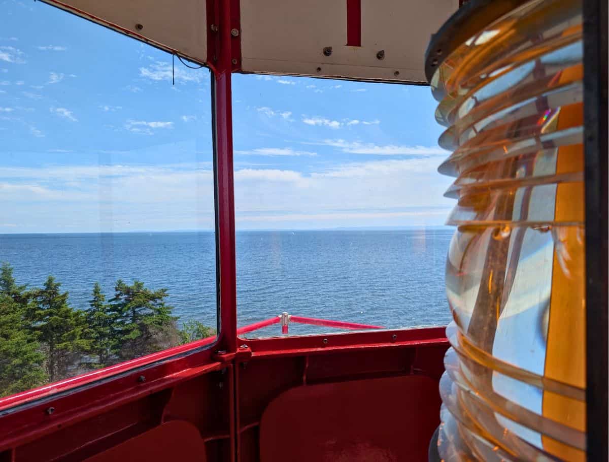 View from the top of Cape Bear Lighthouse with endless ocean and lighthouse lamp