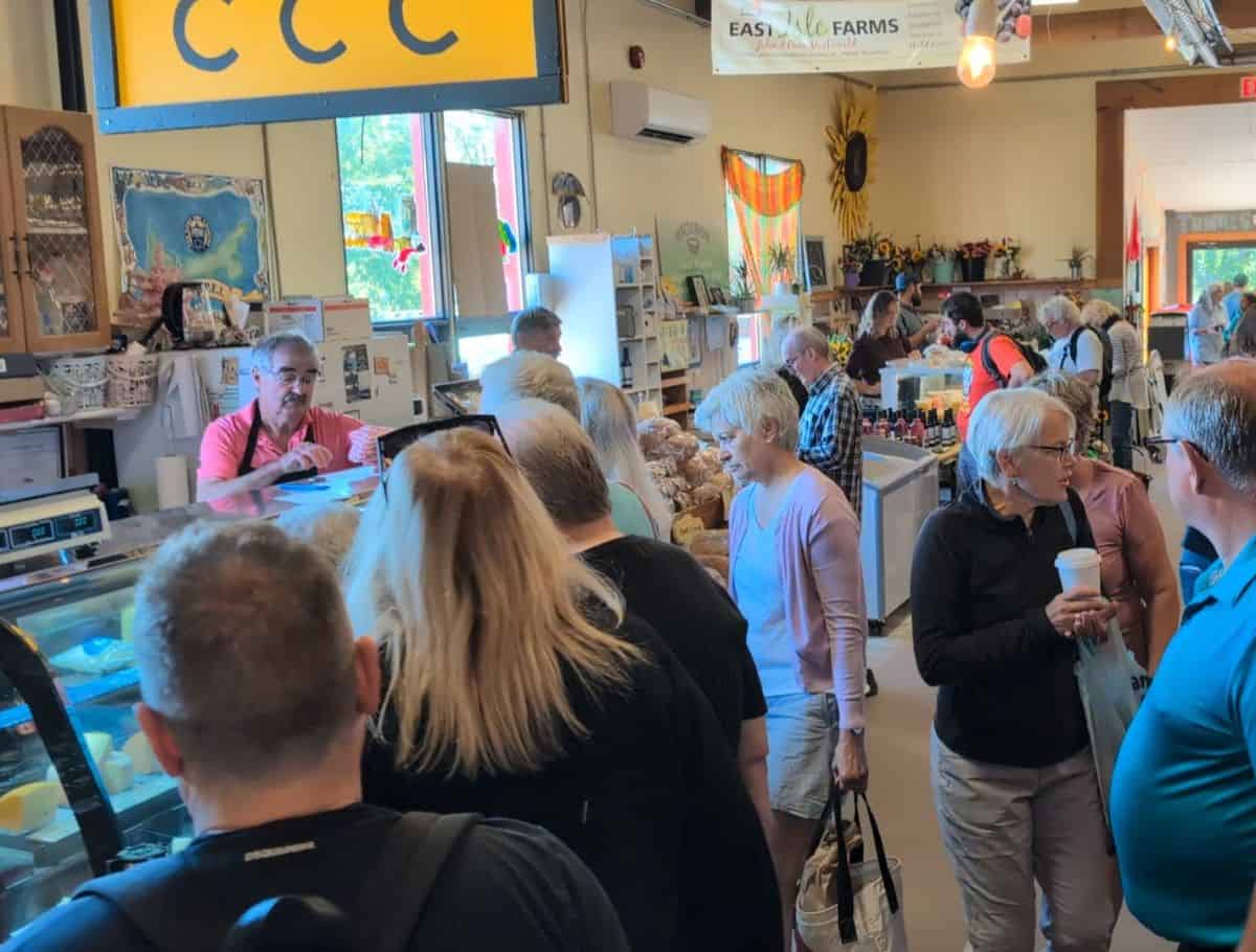 crowd and vendors inside Charlottetown Farmers Market