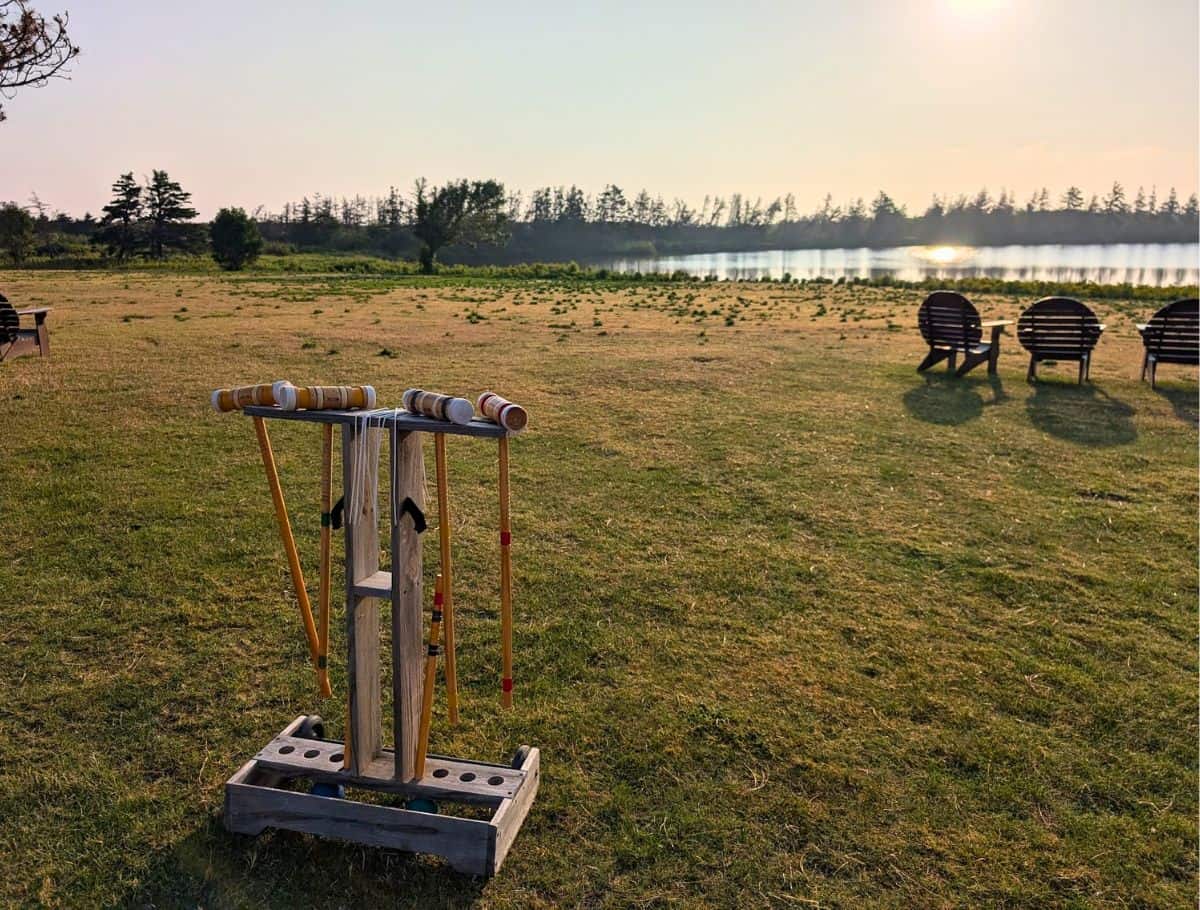 One of two croquet sets on the lawn overlooking dalvay lake and Adirondack chairs