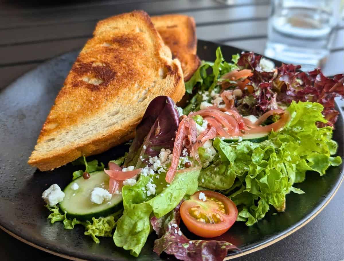 Grilled cheese and light salad lunch plate