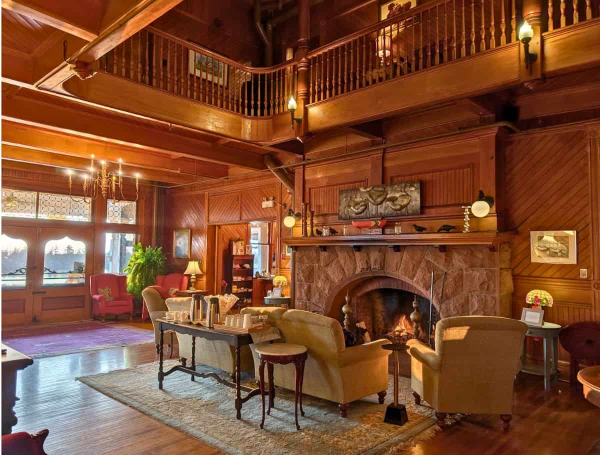 cozy Large stone Lobby fireplace and seating area with coffee bar set up for the morning