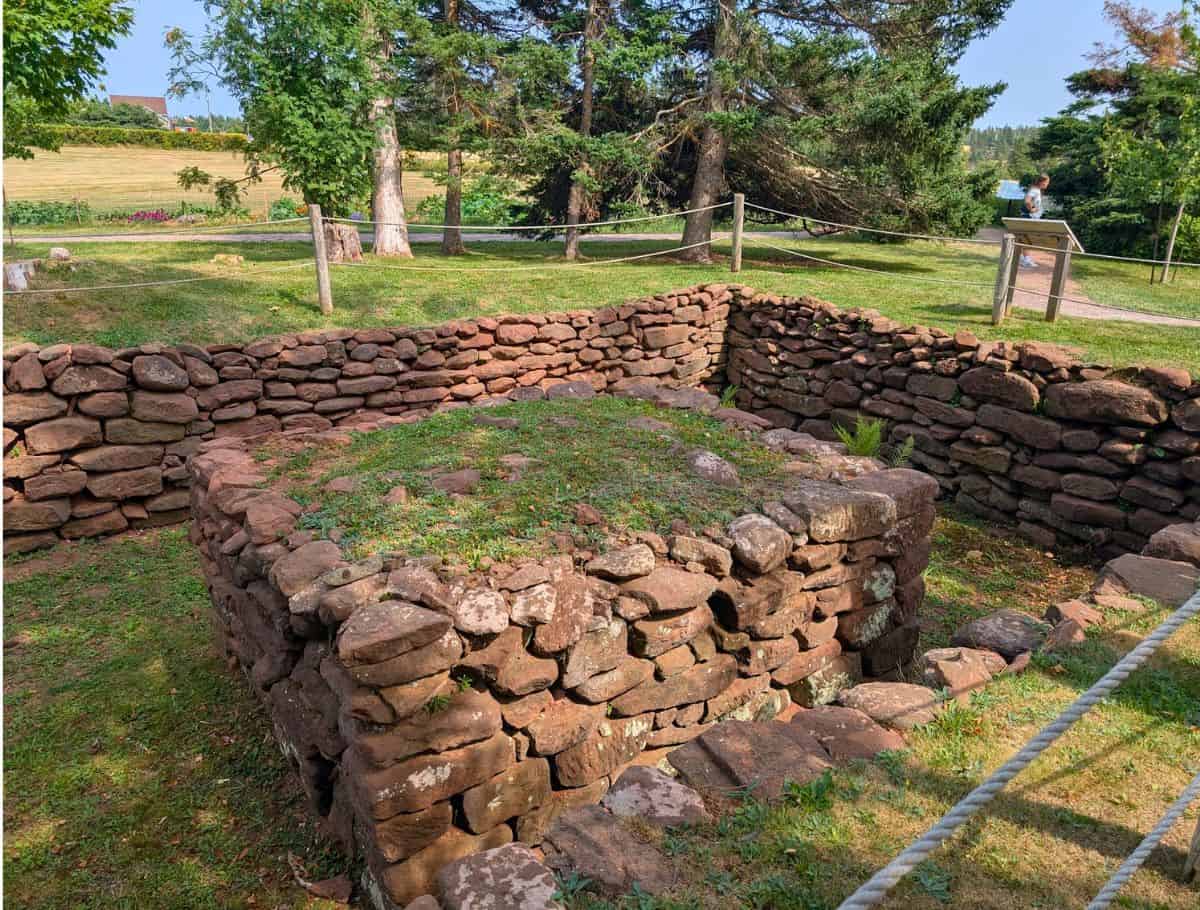 Foundation remains of L.M. Montgomery's grandparent's home made of large rock walls buried in ground
