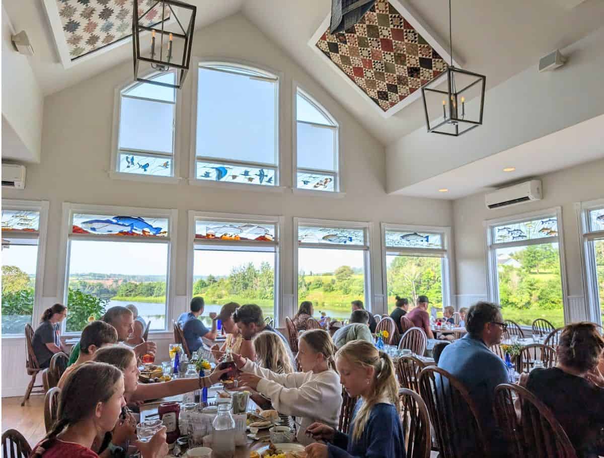 PEI Preserve Co dining room with fish stained glass and overlooking lake