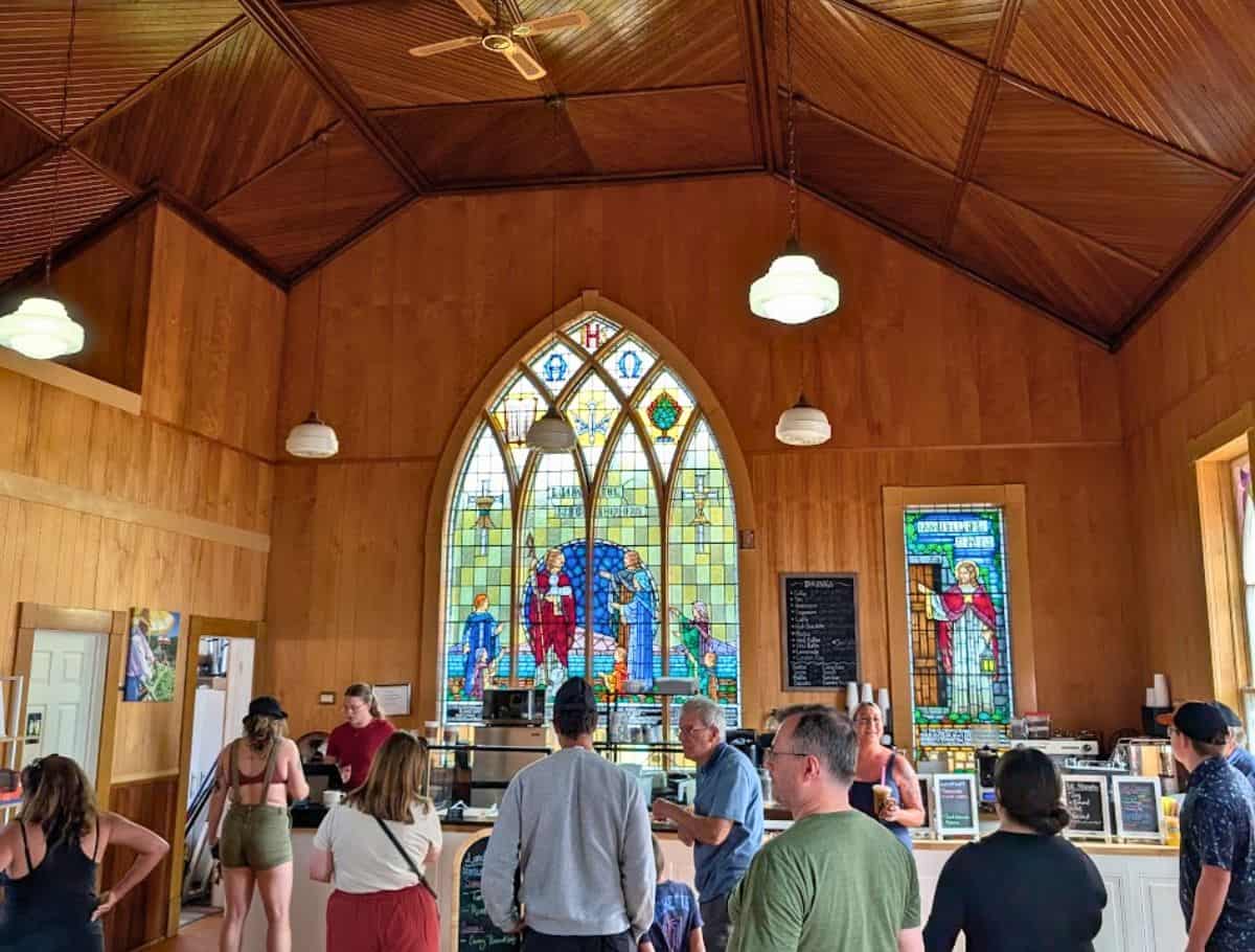 The Willow Bakery & Cafe Stanley Bridge location inside a church with stain glass windows behind bar