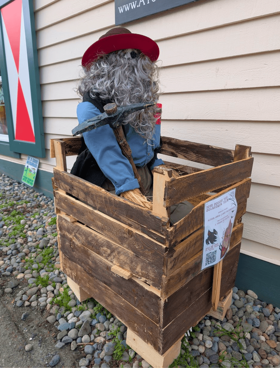 coupeville scarecrow dressed as a miner in a coal mine cart