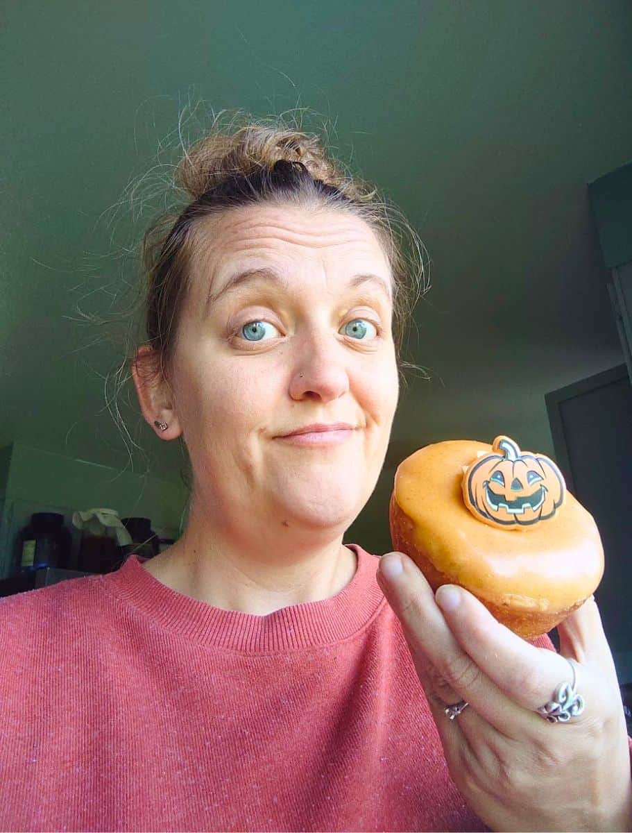 selfie of me with a pumpkin donut from chris's bakery